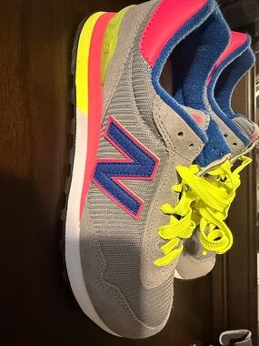 New Balance Gray Sneakers with Blue Logo and Neon Yellow Laces